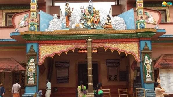 Idagunji Temple entrance with colourful deity sculptures above the gateway